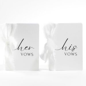 Wedding Vow Books: His & Hers with white ribbons.