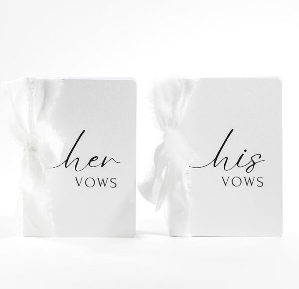 Wedding Vow Books: His & Hers with white ribbons.
